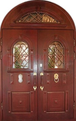 Стальная арочная дверь со стеклом и ковкой ДА-30 в дом из кирпича в Раменском