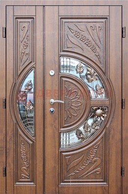 Уличная дверь в цвете Итальянский орех с виноритом и ковкой со стеклом ДВТ-147 в Раменском